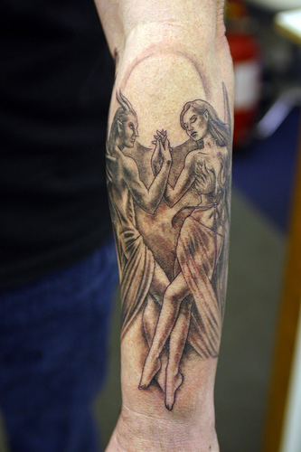 Red Angel Tattoo On Leg Published October 18, 2009 at 333 × 500 in angel 