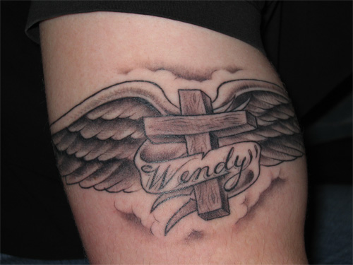 cross tattoos on chest. ANGEL WINGED CROSS TATTOO