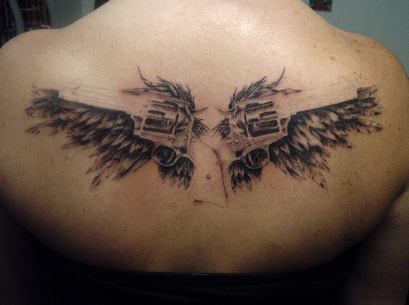 angel wings with guns tattoos. angel wings with guns tattoos