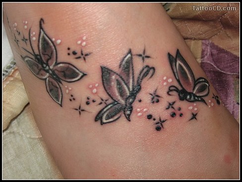 Flower and butterfly tattoo on foot Flower and butterfly tattoo on foot