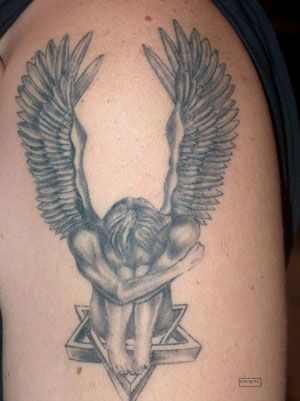 angel devil tattoo angel cross tattoo A marble sculpture of a weeping