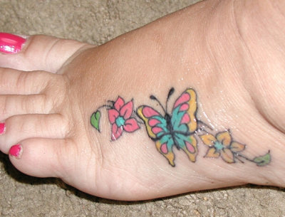 Marilyn Henry of Nampa to matching pink ribbon butterfly tattoos,