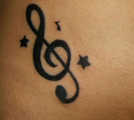 henna tattoo-original music notes. Pisces sign beneath lower right ear,