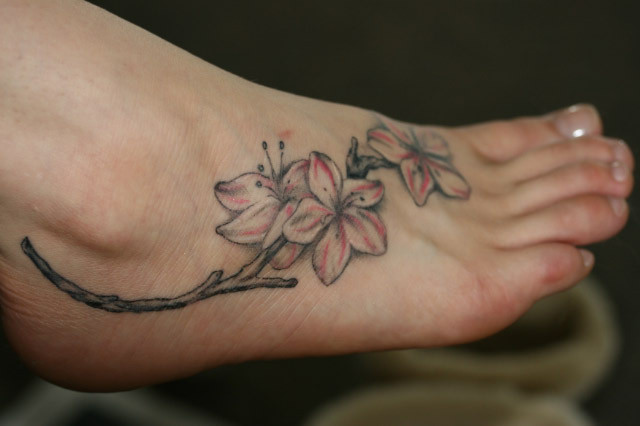 Horseshoe Tattoo On Foot. Girly swirly foot tattoo
